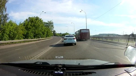 A view through the windshield of a car driving down the highway. Stock Footage 111961128