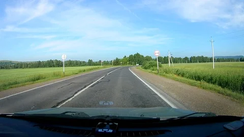 A view through the windshield of a car driving down the highway. Stock Footage 111961257