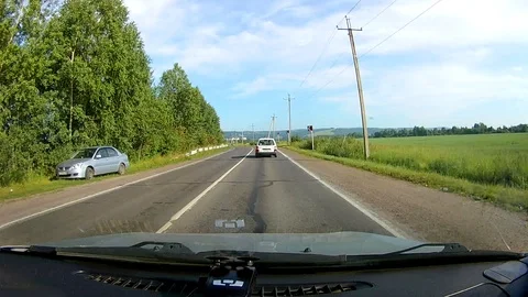 A view through the windshield of a car driving down the highway. Stock Footage 111961291