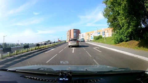 A view through the windshield of a car driving down the highway. Stock Footage 111961320
