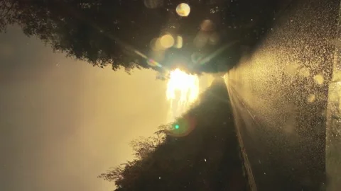 The view through the windshield of the car in heavy rain in a Sunny weather. Slo Vídeos de archivo 141047965
