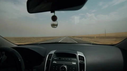 View through windshield of car on movement of trucks on suburban highway 库存影片 236564885