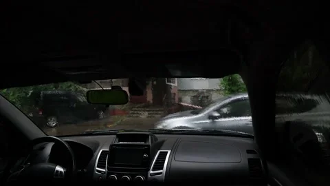 View through the windshield of a car, on a passing car in rain Stock Footage 195213227