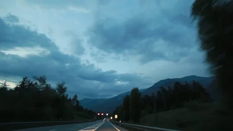 View through the windshield of the car. The Swiss valley at dawn. Stock Footage 73537613
