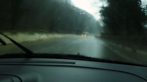 View through the windshield of a car traveling on the road in the rain. Stock Footage 101308521