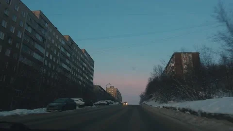 View through the windshield on a city road on a winter evening and on Stock-Footage 155727625