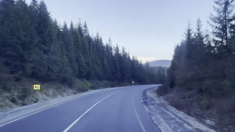 View through the windshield of driving truck along the curve country road with Stock Footage 311180405