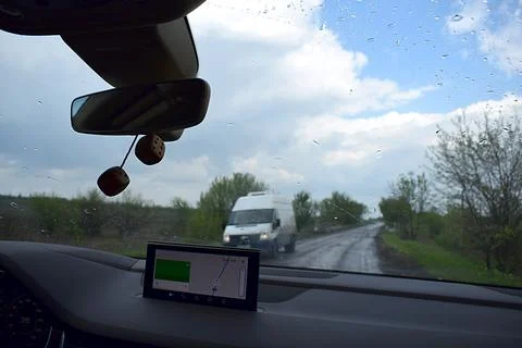 View through the windshield of a road car in the countryside. 스톡 사진