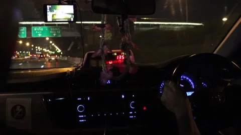 View through the windshield of a taxi driving on a night highway Stock Footage 310178976