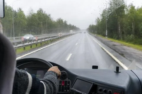 View through the windshield of a tourist bus moving along the highway Foto stock