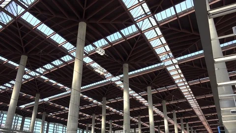 View of tilt down Madrid central train station by day people wait on platform Stock Footage 81977559