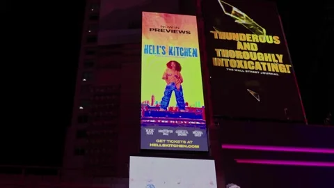 View of Times Square at night with LED advertising panels on skyscraper facades Stock Footage 274915037