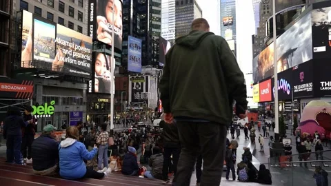 View of Times Square from red stairs. Tourists sightseeing and visiting NYC. Stock Footage 200311685