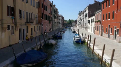 View of a tiny small canal in the middle of buildings in Venice, Italy Stock Footage 68991478