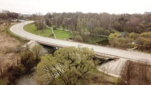 View from the top above the highway with a bridge over the river Stock Footage 305567747