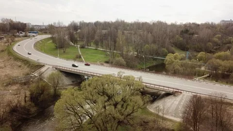 View from the top above the highway with a bridge over the river Stock Footage 305567749