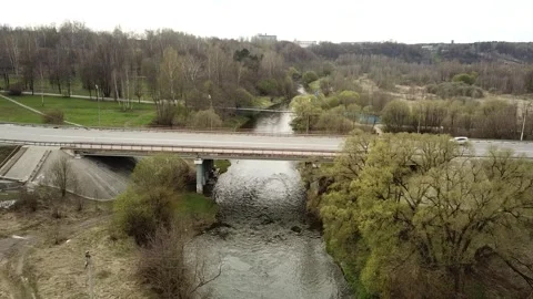 View from the top above the highway with a bridge over the river Stock Footage 305568364