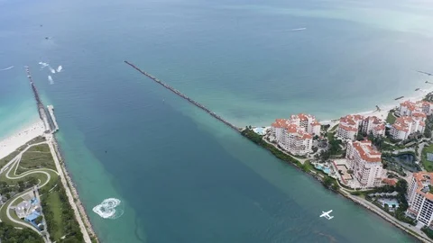 View from the top to airplane flying over water Stock Footage 121163398