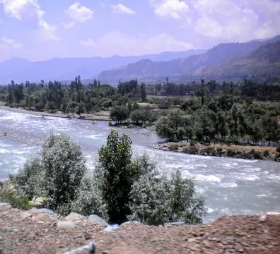 View from top angle of a valley having river flowing in foreground Фото