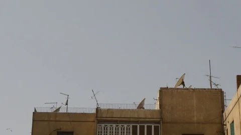 View from top to bottom of high old buildings at cairo, egypt Stock Footage 75056217