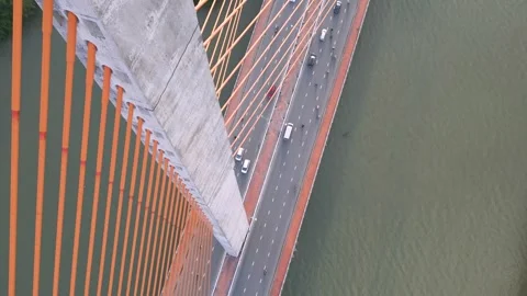 View from the top of a bridge showcasing traffic and river below Video stock 309736155