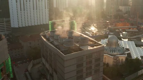 The view from the top of the building, the air conditioning fan emits smoke. Video stock 123818448
