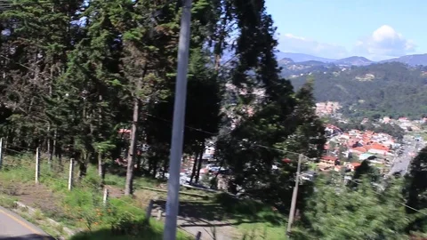 The view on top of a bus while driving down a steep hill Stock Footage 107685496