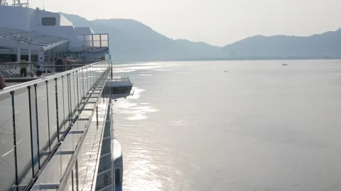 View on the top deck of the giant luxuary cruise ship from the aft area to .. Stock Footage 312168461