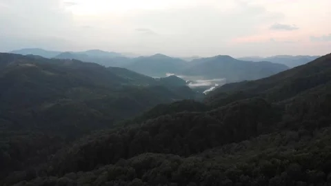 View from the top, the drone flight over the mountains and wild green forest. Stock Footage 196711921