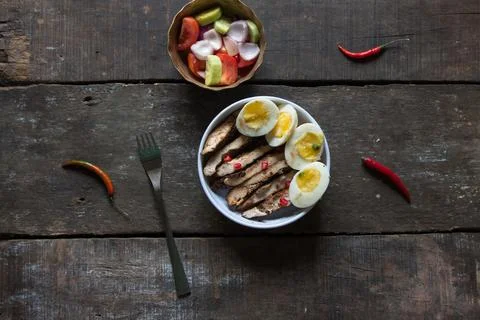 View from top of freshly prepared caesar chicken and egg salad. Stock Photos