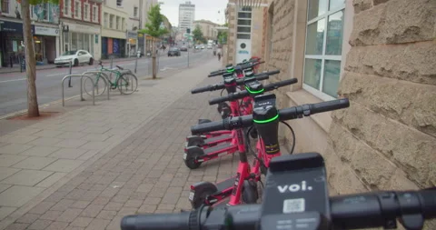 View Top of Hand Controls of Electric Scooters Parked in City Centre Bristol Stock Footage 202558910