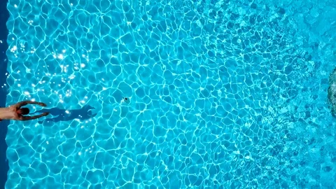 View from the top as a man jumping and dives into the pool Video stock 90979810