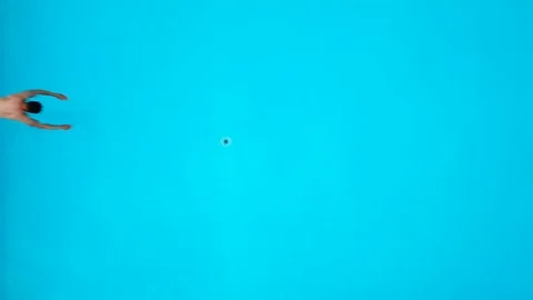 View from the top as a man jumping and dives into the pool under the water Stock Footage 91509679