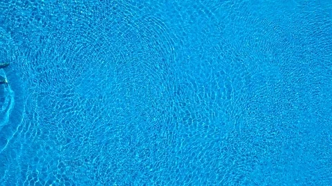 View from the top as a man swims under the water in the pool Stock Footage 115965863