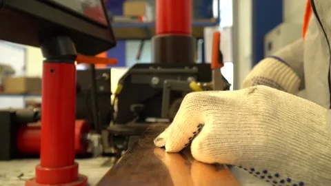 View from the top of a metal piece while its being pushed into a machine Stock Footage 160113801