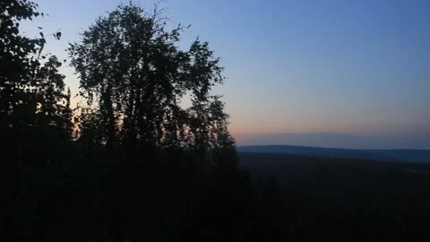 The view from the top of the mountain to the forests and the river. Evening. Stock Footage 136165728