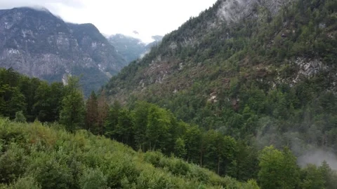 View from the top of a mountain. Mountain landscape in Austria, fog and clouds,  Video stock 294345466