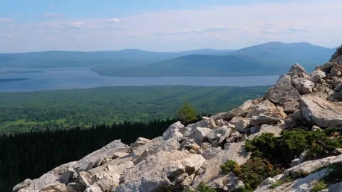 View from the top of the mountain ridge to the high-mountain lake Zyuratkul in t Stock Footage 325352882