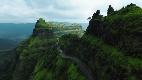 View from the top of the mountain, Two white cars on road in mountains, Stock Footage 285929006