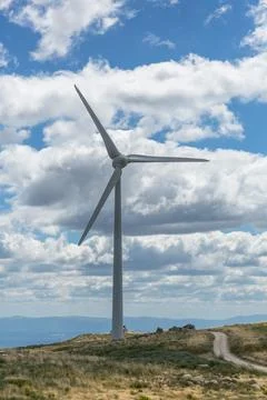 View of a top mountains landscape with a wind turbine Stock Photos