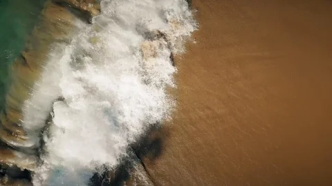 View from the top as ocean waves break on the beach Video stock 101484867