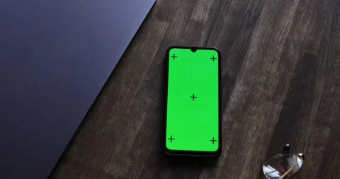 The View From The Top. Phone with a Green Screen and Tracking Dots on the Table Stock Footage 136091408