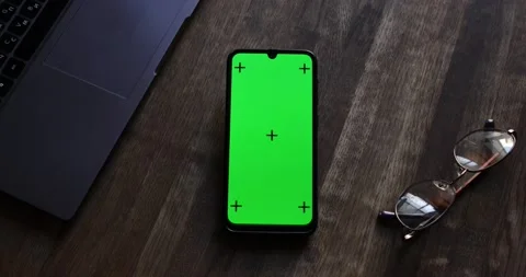 The View From The Top. Phone with a Green Screen and Tracking Dots on the Table Vídeo Stock 219759627