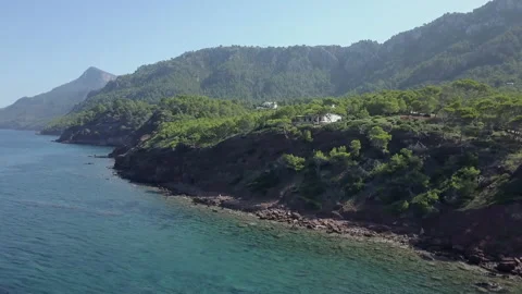 View from the top of pine clad mountains by the sea water Video stock 221726862