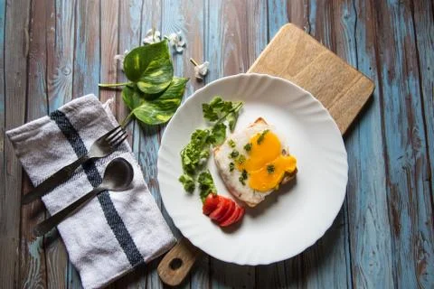 View from top of poached egg on bread with condiments Stock Photos