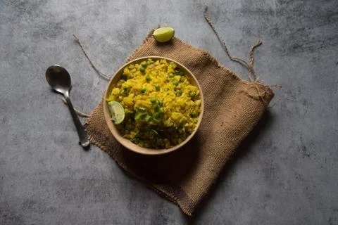 View from top of poha or cooked flattened rice in a bowl Stock Photos
