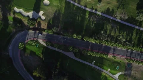 View from the top to the road among the golf courses Stock Footage 232241437