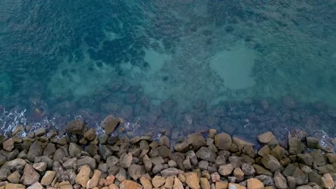 View from the top on rocks and calm turquoise sea waves. Stock Footage 230923710