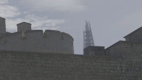 View of the top of the shard over the Tower of London Stock Footage 98694951