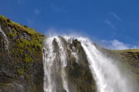 View of the top of the waterfall on a windy day Stock Photos